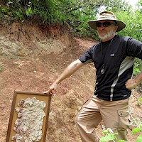David M. Jones showcasing a Los Filos mineralized intrusion sample to Vuelcos surface intrusion outcrop indicating similar mineralization