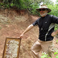 David M. Jones showcasing a Los Filos mineralized intrusion sample to the nearby Vuelcos surface intrusion outcrop indicating similar mineralization