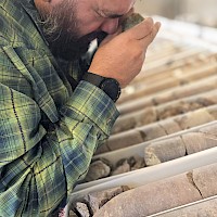 Mexican Geologist Santiago Rojas examining drill core