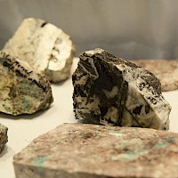Various rock samples from Alamos project displaying the mineralization multiphase events