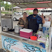 Local Mexican family selling a local delicacy of seafood soup at the weekly Sunday market in Alamos