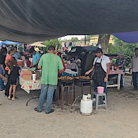 Bustling local food vendor at the weekly Sunday market in Alamos