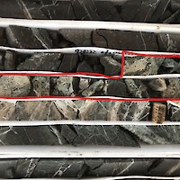 AL17-007_NuevaEuropa_IMG_1304 – “Vein breccia of Nueva Europa vein zone. Note quartz-carbonate vein/vein breccia matrix cutting dark greenish-grey andesite.  Sample interval 273.30-274.05 m (0.75 m) (in red outline) assayed 694 g/t Ag, 23 ppb Au, 0.34% Cu, 0.63% Pb, 1.30% Zn.”